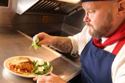 LNER-Chef-with-new-First-Class-dish_cropped-scaled-1.jpg